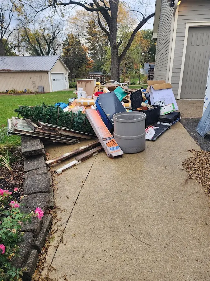 Dumpster being loaded with debris for Residential Dumpster Rental in Willowbrook